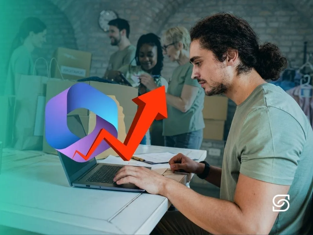 Photo of a young man on a laptop with a rising red arrow and Microsoft 365 logo overlaid, with charity shop volunteers sorting donation boxes behind him.